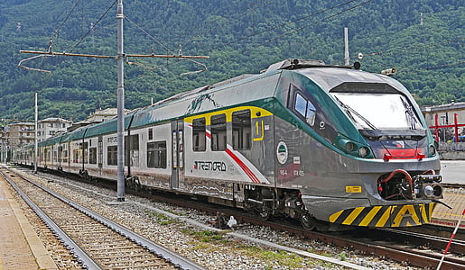 gray and white train on tracks thumbnail