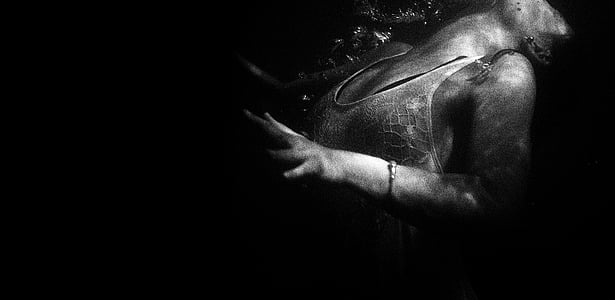grayscale photography of woman underwater thumbnail