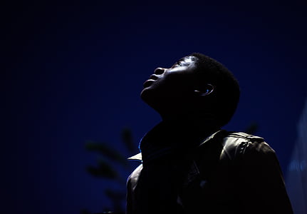 man in black leather zip-up jacket during nighttime thumbnail