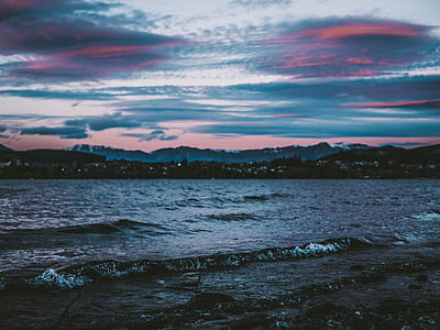 wavy sea under gray sky thumbnail