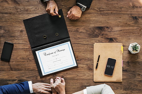 flat-lay photography of certificate signing thumbnail