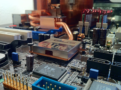 person taking photo of black Asus computer motherboard thumbnail