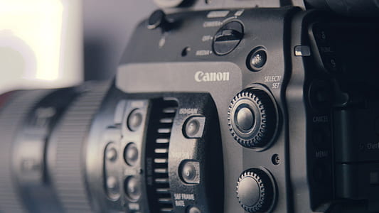 black Canon DSLR camera thumbnail
