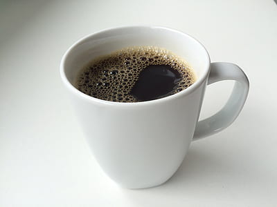 white ceramic mug with black liquid thumbnail