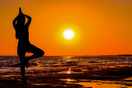 silhouette of woman standing near seashore thumbnail