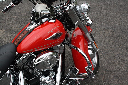 red and silver motorcycle on brown floor thumbnail