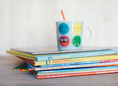 selective focus photo of books on gray board thumbnail