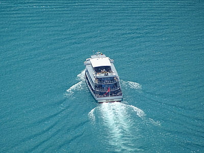 white and blue cruise ship on body of water thumbnail
