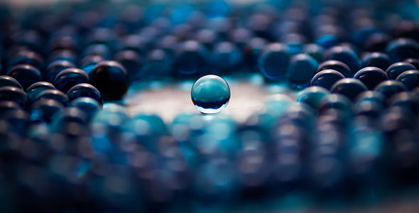 selective focus photography of blue marble ball thumbnail