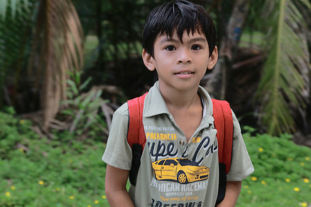 boy in gray polo shirt thumbnail