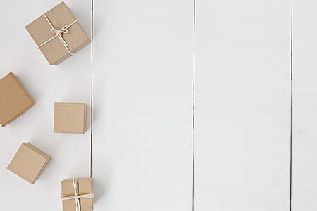 five brown gift boxes on the white wood thumbnail