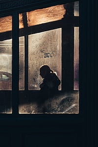 silhouette photo of woman inside room thumbnail