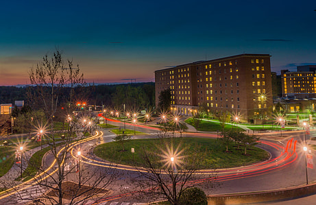 photo of road with buildings and plants thumbnail