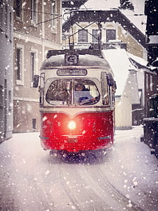 red and gray peak tram during snowy day thumbnail