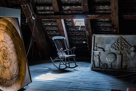 gray rocking chair near window thumbnail