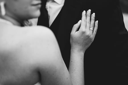 grayscale photo of woman wearing ring thumbnail