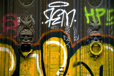 black door with paints at daytime thumbnail