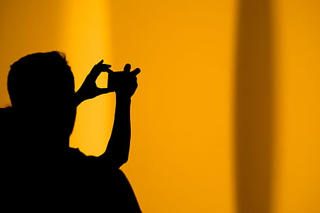 silhouette of person taking photo thumbnail