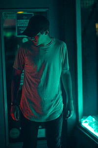 man wearing gray shirt and black cap thumbnail