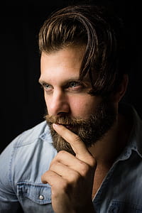 man wearing blue denim sports shirt taking close-up selfie thumbnail