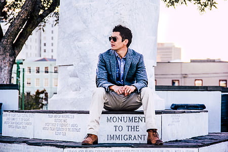 man looking side sitting on monument thumbnail