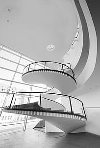 Grayscale Photo of Spiral Stairs thumbnail