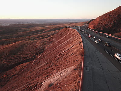 gray asphalt road on mountain cliff thumbnail