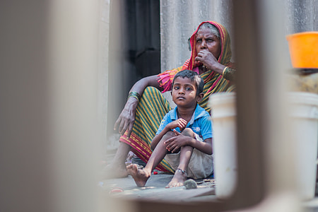 woman and boy sitting on gray floor thumbnail