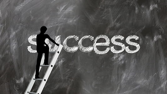 silhouette of man climbing through success thumbnail