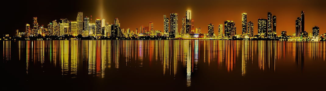 silhouette of high-rise buildings at nighttime thumbnail