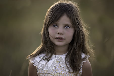 selective photography of girl wearing floral lace sleeveless top thumbnail