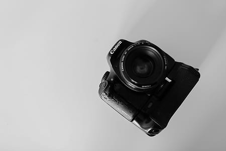 black Canon DSLR camera thumbnail