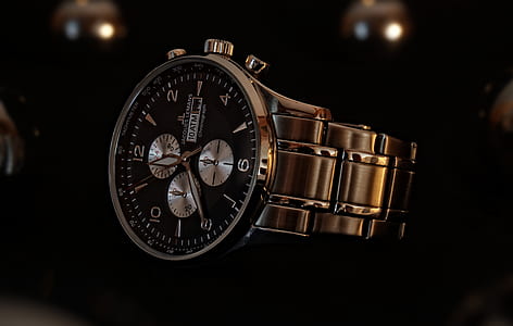 round black and silver-colored watch at 11:40 thumbnail