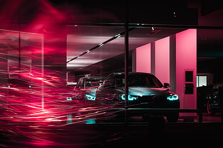 gray BMW M-series cars in glass building thumbnail