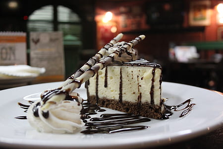 sliced cheese cake with chocolate wafer stick thumbnail