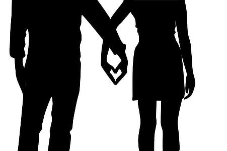 silhouette of man and woman holding hands thumbnail