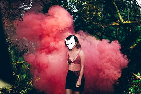woman wearing red brassiere standing near red smoke thumbnail