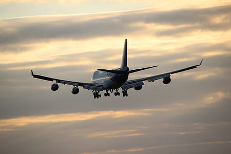 gray airplane during sunset thumbnail
