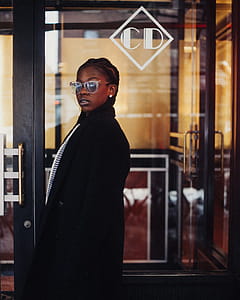Woman Wearing Black Coat and Sunglasses thumbnail