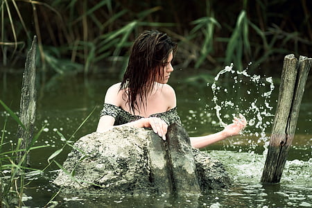 woman hiding at body of water thumbnail