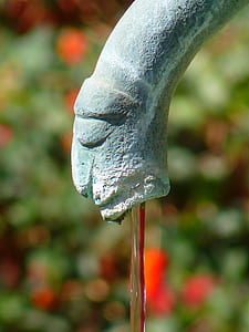 concrete fountain nozzle in closeup photography thumbnail