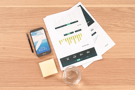 black Android smartphone on brown table thumbnail