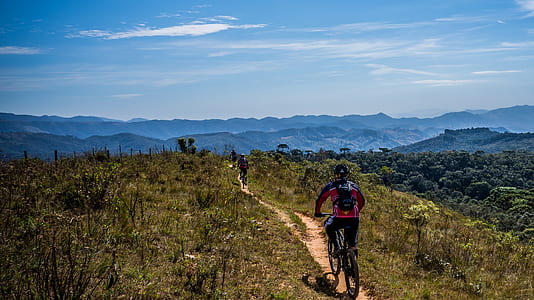 man riding bicycle during daytime thumbnail