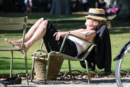 woman sitting on gray steel armchair thumbnail