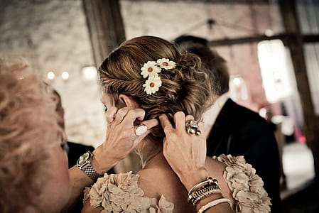 Woman Fixing Other Woman's Hair thumbnail