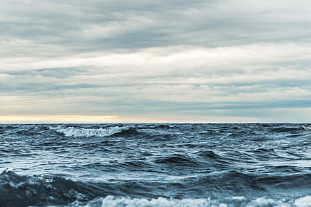 blue sea under cloudy sky thumbnail