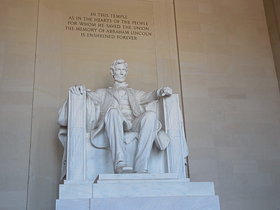 man sitting on armchair statue thumbnail