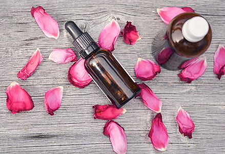 two labeled dropper bottles with flower petals thumbnail