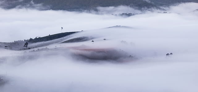 black mountains on white fog thumbnail