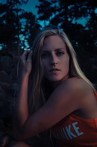 woman wearing orange tank top thumbnail